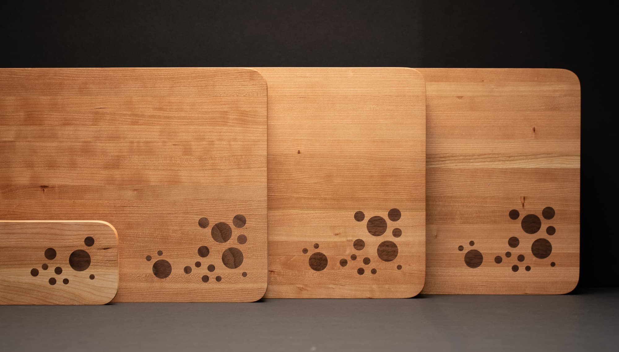 The Maine Object cutting board and serving boards, edge-grain cherry with walnut inlay